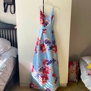 Light blue formal dress with flowers. Straps adjust to fit a size 3.